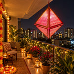 Load image into Gallery viewer, Kandil-Harshal bamboo lantern hanging in a home balcony at deiwali festival